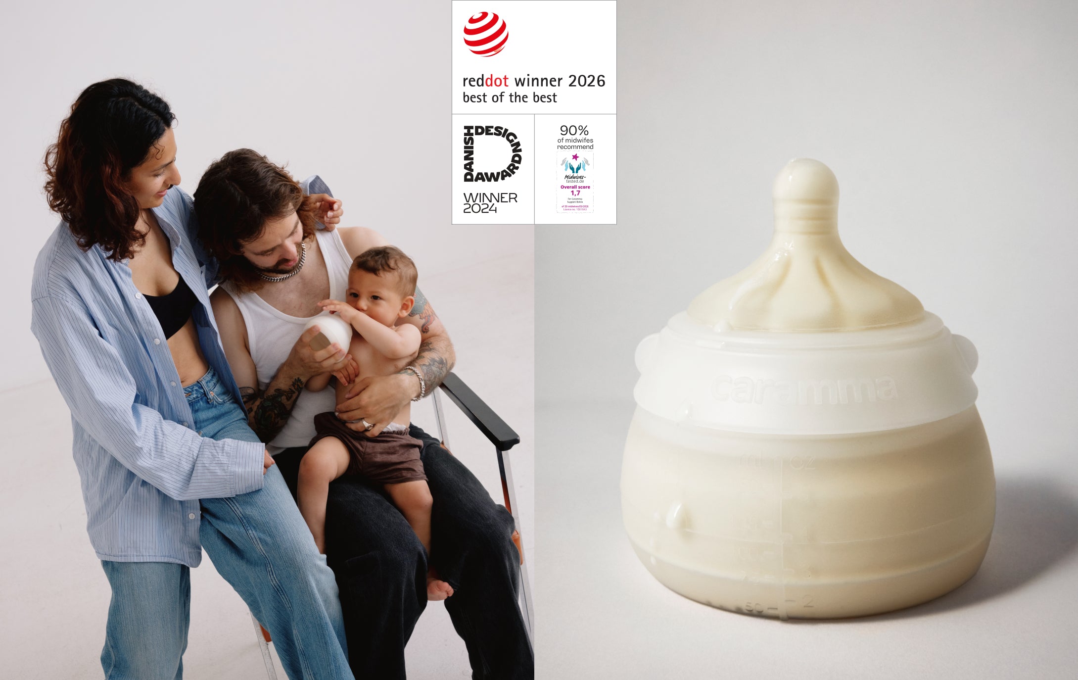 A large off-white silicone baby bottle with a flared neck and nipple is shown on the right against a light gray studio background. On the left, a woman and a man are seated with a baby, and a vertical award badge for 'red dot winner 2026 best of the best' and 'Danish Design Award winner 2024' and "90% of midwifes recommend" is overlaid near the top center.