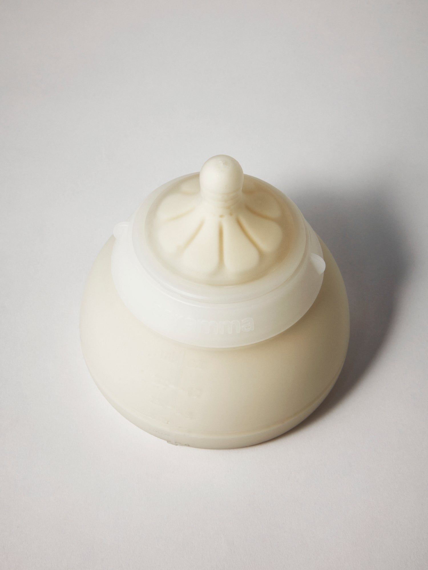 Large caramma baby bottle with breastmilk or formula for natural slow flow