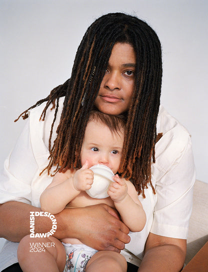 Mother and baby sharing a quiet moment while using Caramma baby bottle. Petra Kleis