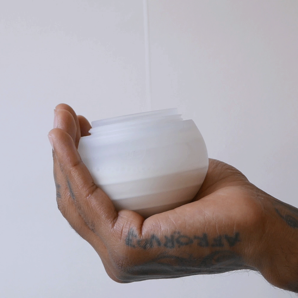 Fill the caramma support bottle with breastmilk or formula to prepare for nursing your infant in natural positions